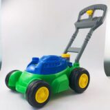 blow molded push lawn mower toy in blue and green colors
