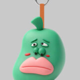 Sad pear baby PVC keychain with drooping eyes and downturned lips