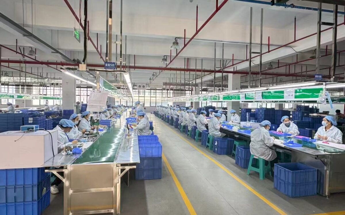 Plastic toy assembly line workers at Meida Toys factory
