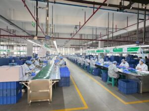 Plastic toy assembly line workers at Meida Toys factory